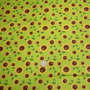 Tissu popeline coton vert aux tournesols jaunes & feuilles vertes - TissusPapi.com