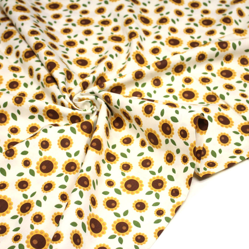 Tissu popeline coton blanc aux tournesols jaunes & feuilles vertes - TissusPapi.com