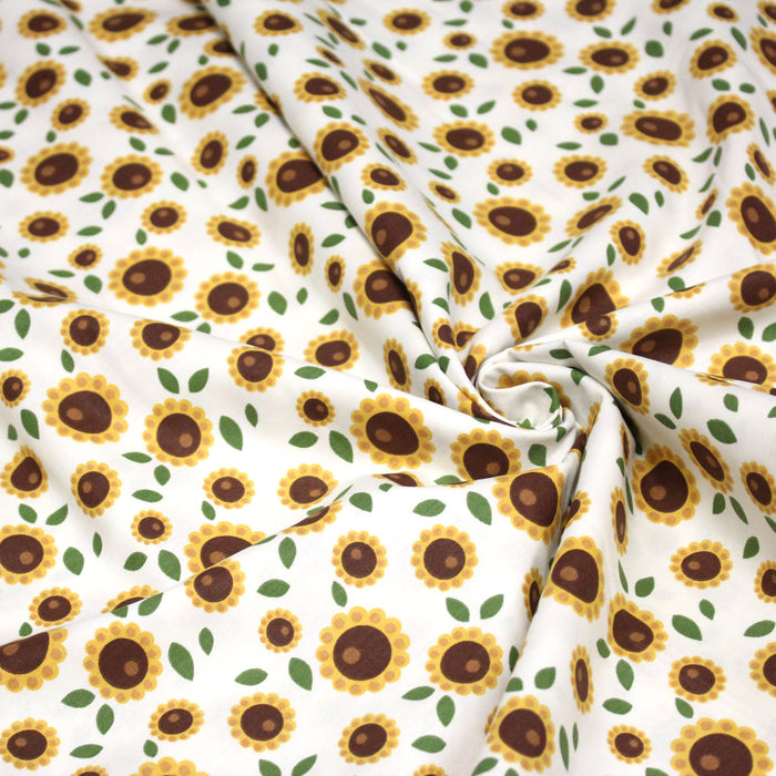 Tissu popeline coton blanc aux tournesols jaunes & feuilles vertes - TissusPapi.com
