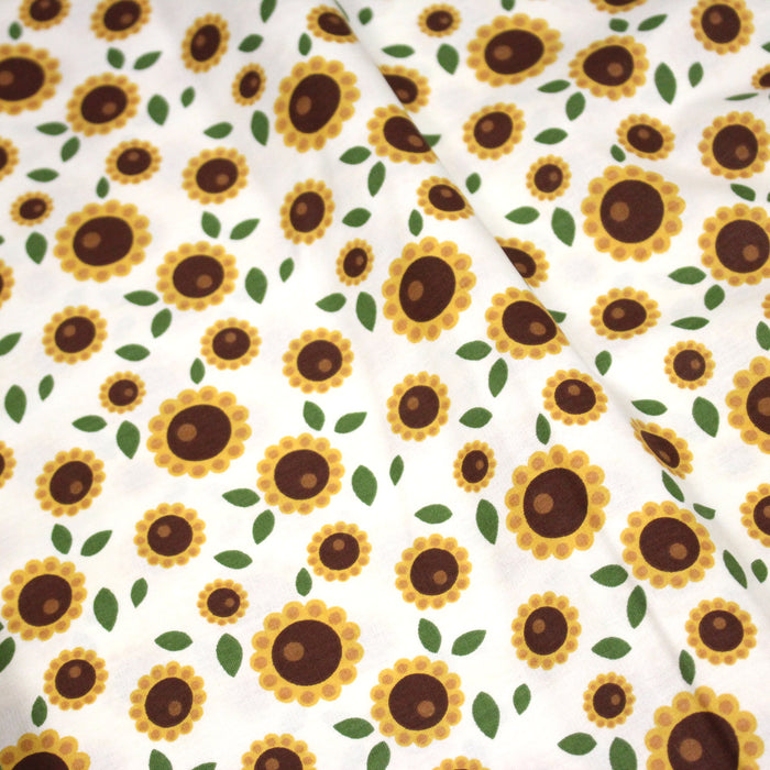 Tissu popeline coton blanc aux tournesols jaunes & feuilles vertes - TissusPapi.com