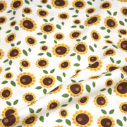 Tissu popeline coton blanc aux tournesols jaunes & feuilles vertes - TissusPapi.com