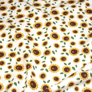 Tissu popeline coton blanc aux tournesols jaunes & feuilles vertes - TissusPapi.com