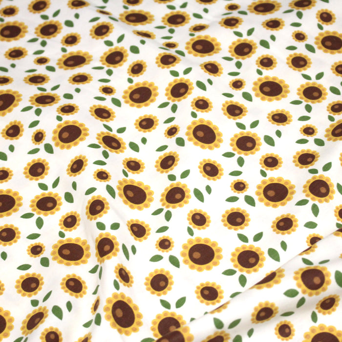Tissu popeline coton blanc aux tournesols jaunes & feuilles vertes - TissusPapi.com