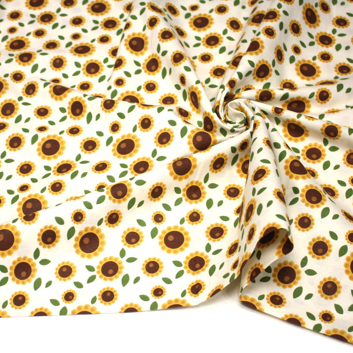Tissu popeline coton blanc aux tournesols jaunes & feuilles vertes - TissusPapi.com