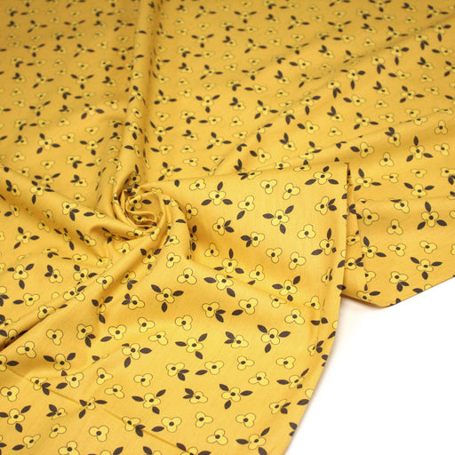 Tissu popeline coton jaune aux fleurs graphiques jaunes - TissusPapi.com