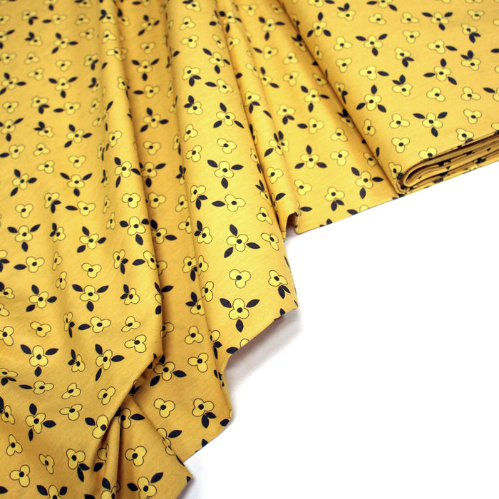 Tissu popeline coton jaune aux fleurs graphiques jaunes - TissusPapi.com