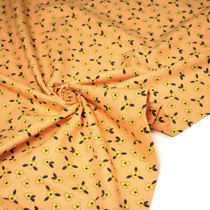 Tissu popeline coton corail aux fleurs graphiques jaunes - TissusPapi.com
