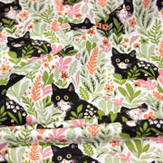 Tissu cotonnade aux chats dans les fleurs roses et vertes - OEKO - TEX STANDARD 100 - TissusPapi.com