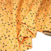 Tissu popeline coton corail aux fleurs graphiques jaunes - TissusPapi.com