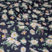 Tissu popeline coton bleu aux marguerites blanches et jaunes - TissusPapi.com