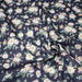 Tissu popeline coton bleu aux marguerites blanches et jaunes - TissusPapi.com