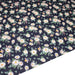 Tissu popeline coton bleu aux marguerites blanches et jaunes - TissusPapi.com
