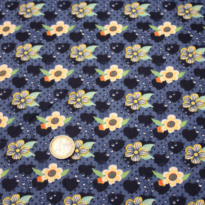 Tissu popeline coton bleu aux coeurs noirs et petits fleurs multicolores - TissusPapi.com