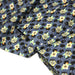 Tissu popeline coton bleu aux coeurs noirs et petits fleurs multicolores - TissusPapi.com