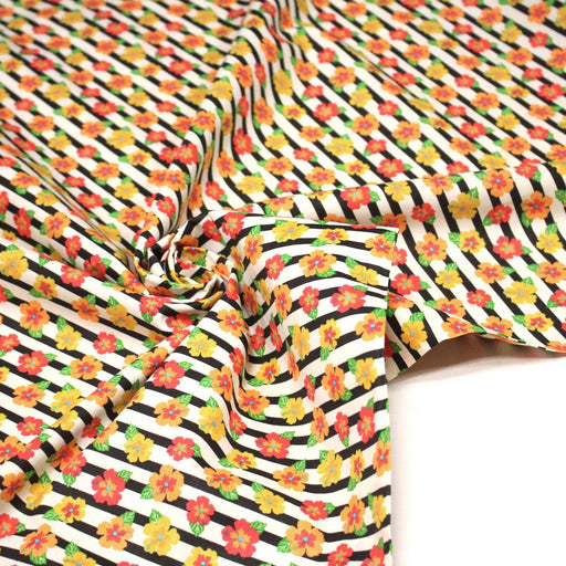 Tissu popeline coton, rayures écrues et noires aux fleurs d'hibiscus multicolores - TissusPapi.com