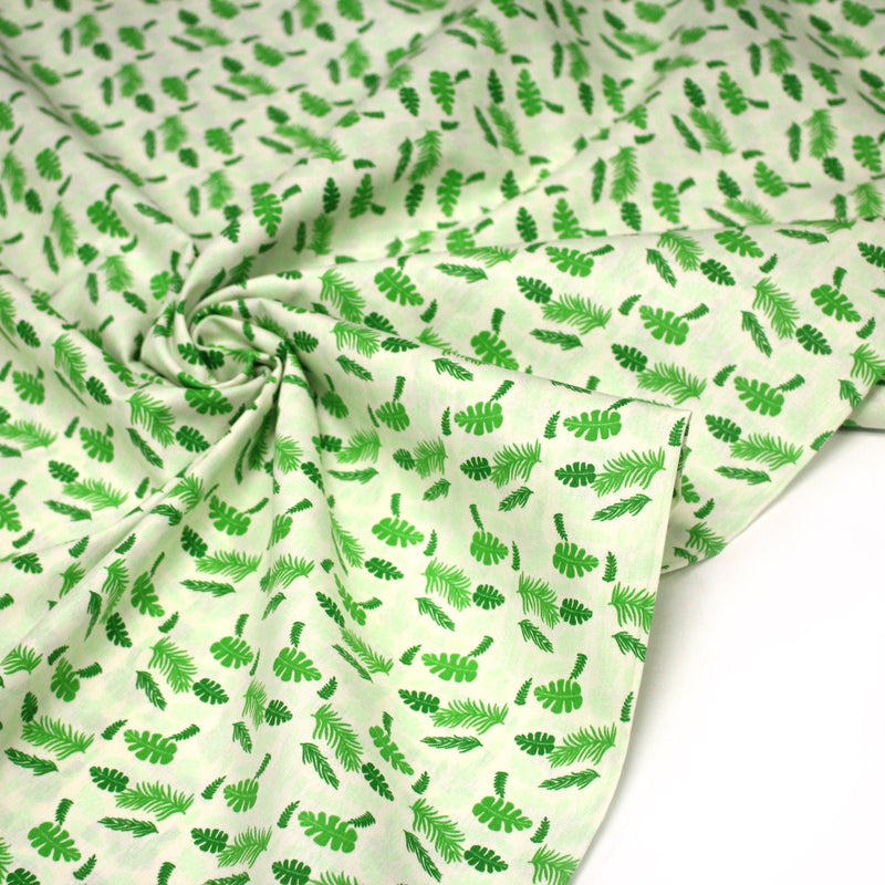 Tissu popeline coton écru aux fougères et feuilles tropicales vertes - TissusPapi.com