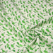 Tissu popeline coton écru aux fougères et feuilles tropicales vertes - TissusPapi.com