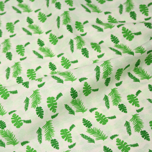 Tissu popeline coton écru aux fougères et feuilles tropicales vertes - TissusPapi.com