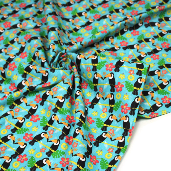 Tissu popeline coton turquoise aux toucans et plantes tropicales multicolores - TissusPapi.com
