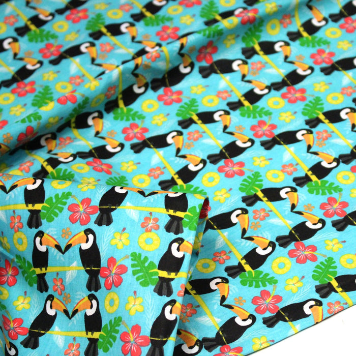 Tissu popeline coton turquoise aux toucans et plantes tropicales multicolores - TissusPapi.com