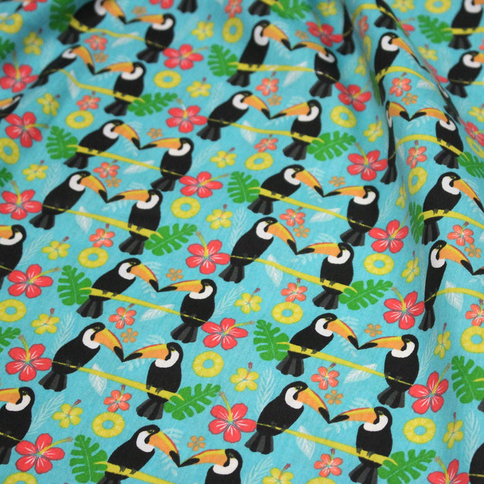 Tissu popeline coton turquoise aux toucans et plantes tropicales multicolores - TissusPapi.com