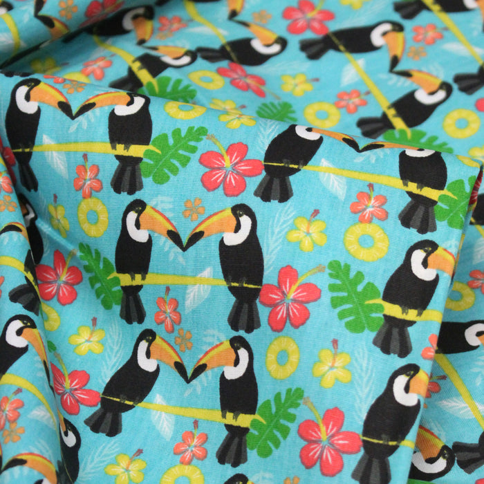 Tissu popeline coton turquoise aux toucans et plantes tropicales multicolores - TissusPapi.com