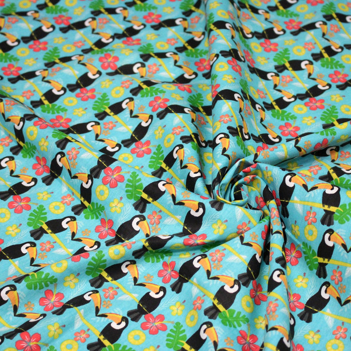 Tissu popeline coton turquoise aux toucans et plantes tropicales multicolores - TissusPapi.com