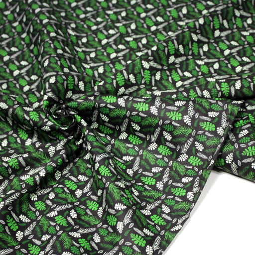 Tissu popeline coton noir aux fougères et feuilles tropicales vertes - TissusPapi.com