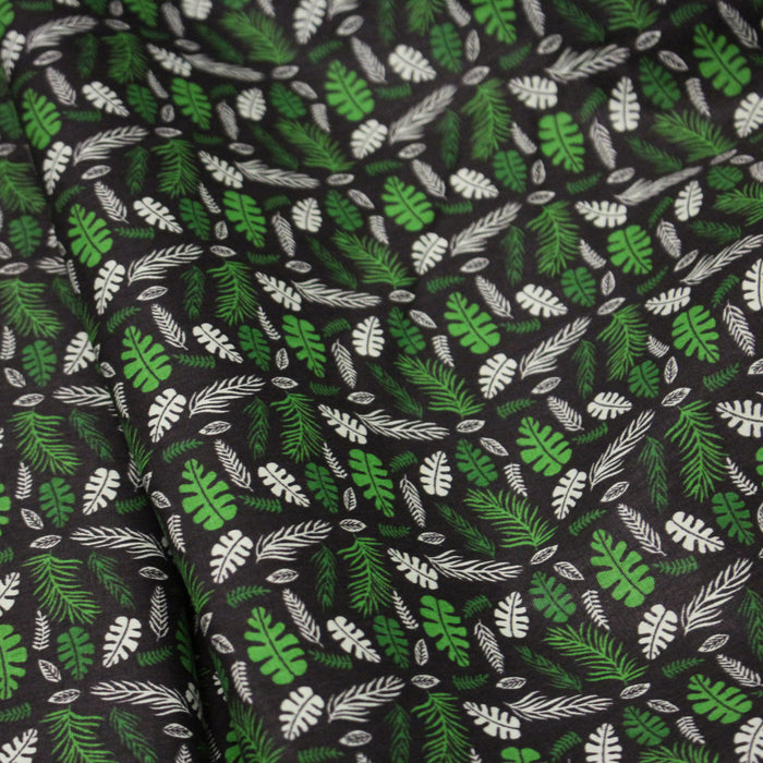 Tissu popeline coton noir aux fougères et feuilles tropicales vertes - TissusPapi.com