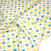 Tissu popeline coton blanc aux fleurs graphiques jaunes et bleues - TissusPapi.com