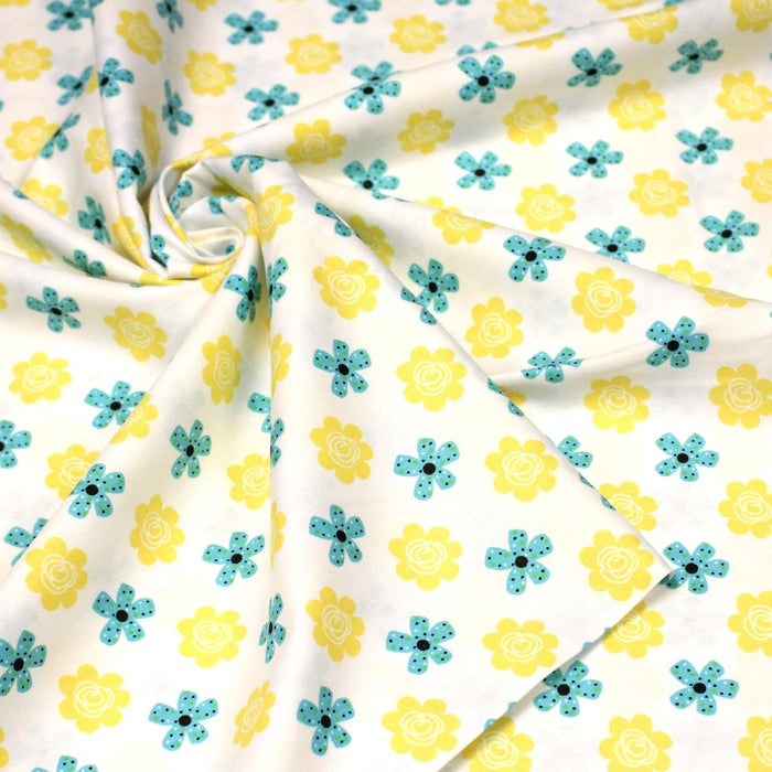 Tissu popeline coton blanc aux fleurs graphiques jaunes et bleues - TissusPapi.com