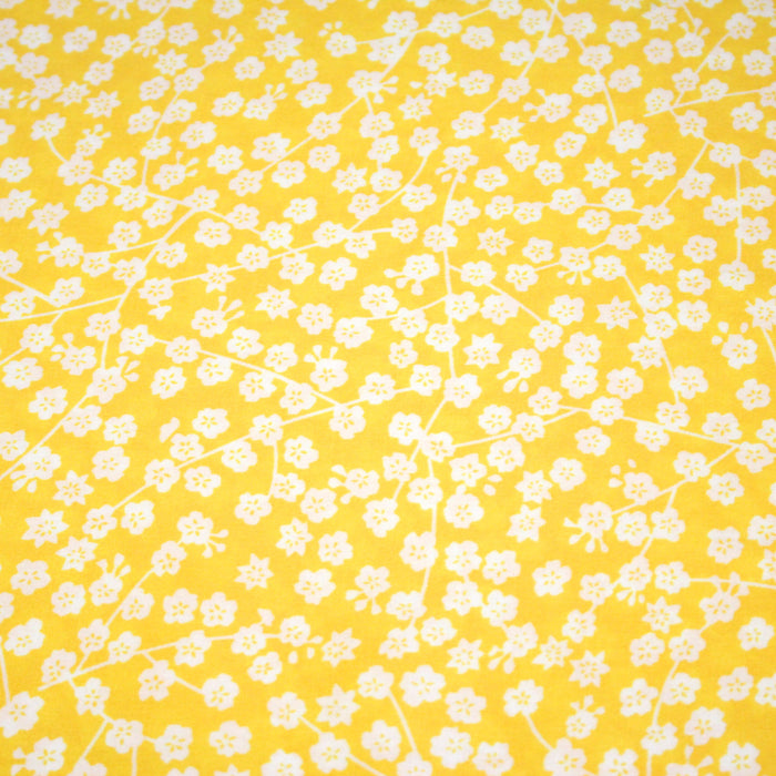 Tissu Viscose fluide jaune bouton d'or aux fines fleurs blanches
