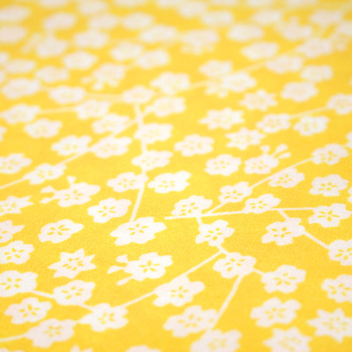 Tissu Viscose fluide jaune bouton d'or aux fines fleurs blanches