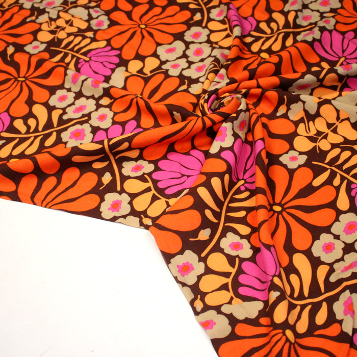 Tissu Viscose fluide SEVENTIES floral marron et orange - OEKO-TEX