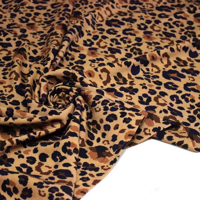 Tissu Viscose fluide LYNX motif léopard ocre et noir – STANDARD 100 OEKO-TEX