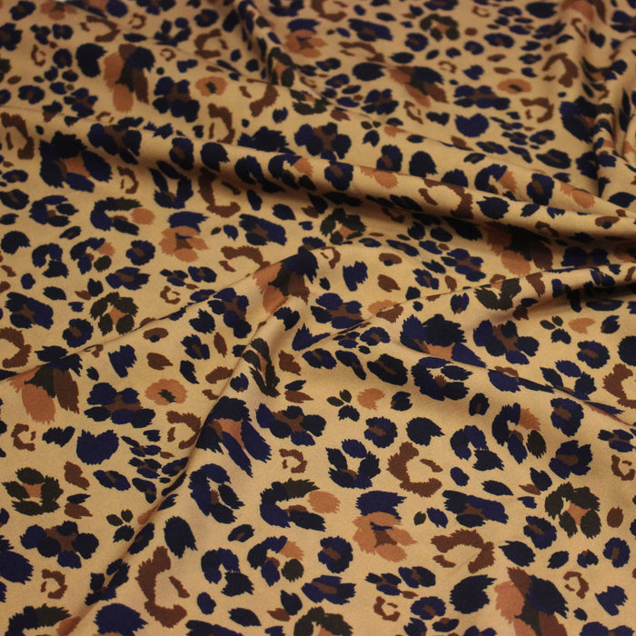 Tissu Viscose fluide LYNX motif léopard ocre et noir – STANDARD 100 OEKO-TEX