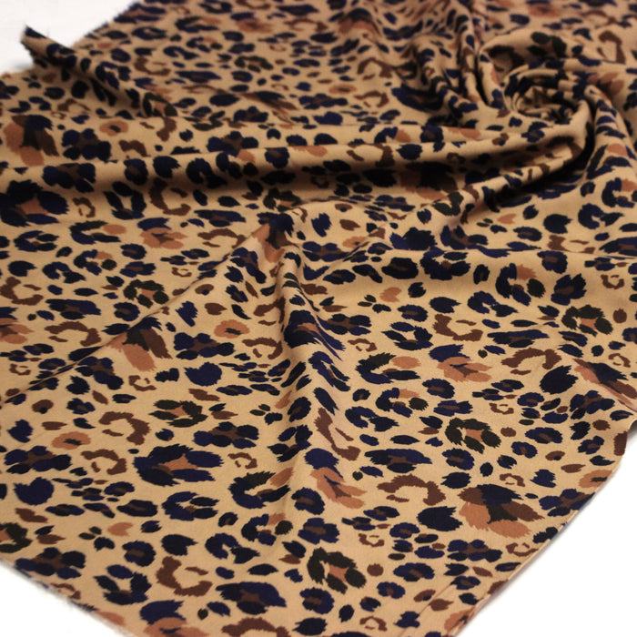 Tissu Viscose fluide LYNX motif léopard ocre et noir – STANDARD 100 OEKO-TEX