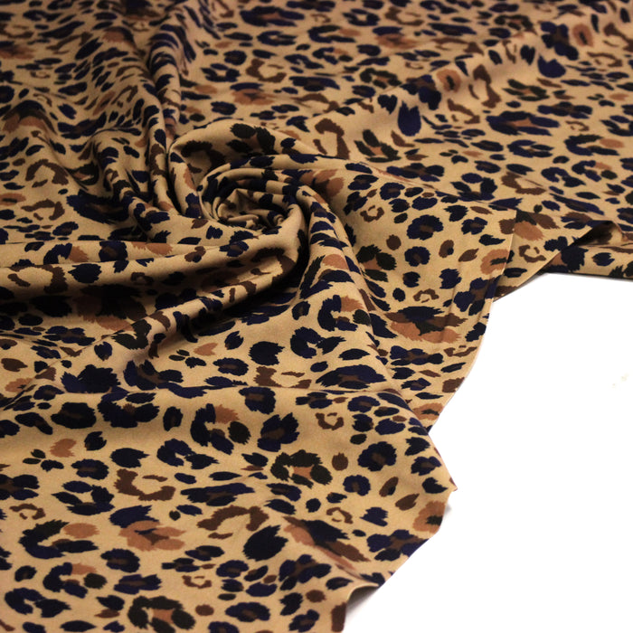 Tissu Viscose fluide LYNX motif léopard ocre et noir – STANDARD 100 OEKO-TEX