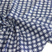 Tissu coton fin imprimé INDIENNES, fleurs blanches traditionnelles sur fond bleu rayé - TissusPapi.com