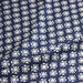 Tissu coton fin imprimé INDIENNES, fleurs blanches traditionnelles sur fond bleu rayé - TissusPapi.com