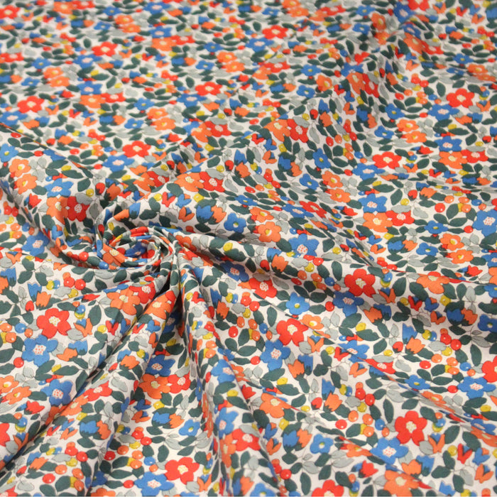 Tissu popeline de coton fleurie aux fleurs bleues, rouges et oranges - COLLECTION FLORALE