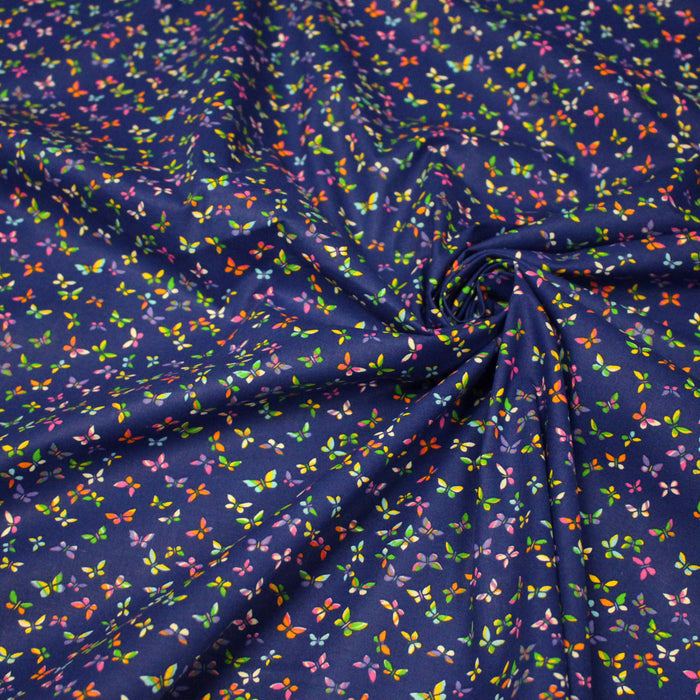 Tissu cotonnade bleue aux papillons multicolores - OEKO-TEX STANDARD 100