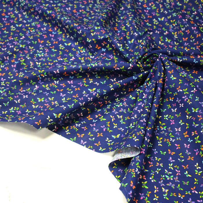 Tissu cotonnade bleue aux papillons multicolores - OEKO-TEX STANDARD 100