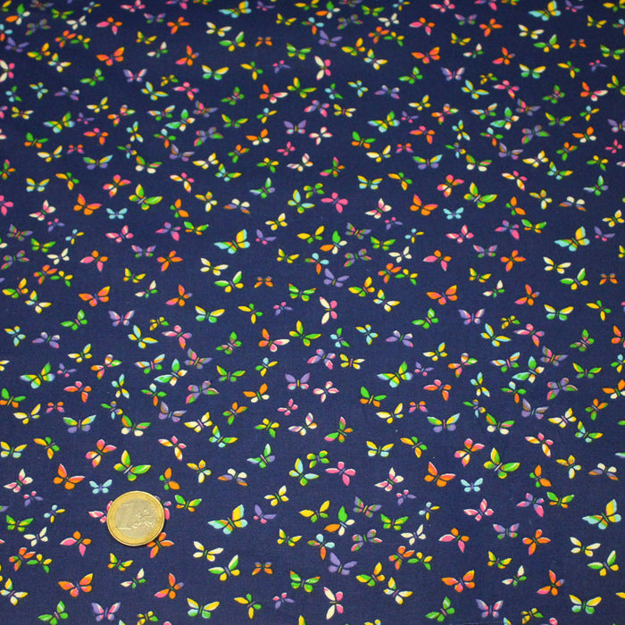 Tissu cotonnade bleue aux papillons multicolores - OEKO-TEX STANDARD 100