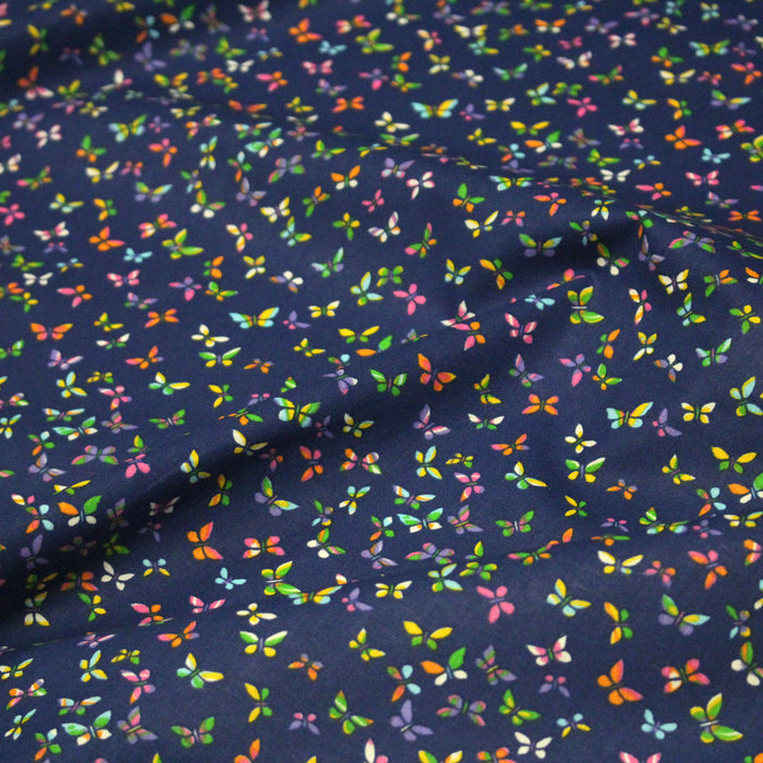 Tissu cotonnade bleue aux papillons multicolores - OEKO-TEX STANDARD 100