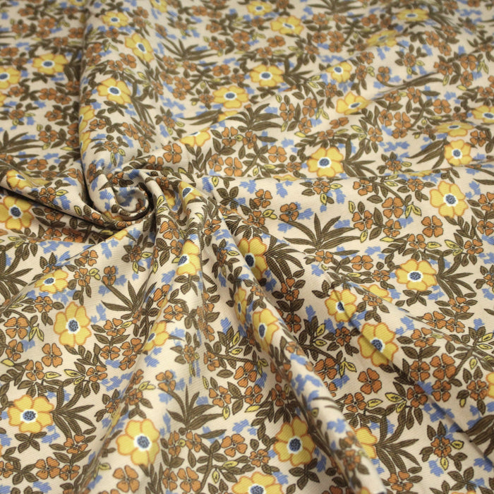 Tissu velours milleraies imprimé écru aux fleurs jaunes et bleues - OEKO-TEX