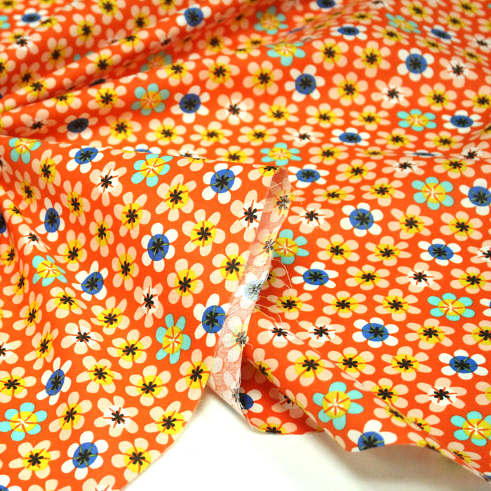 Tissu cotonnade orange aux fleurs multicolores - OEKO-TEX STANDARD 100