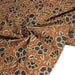 Tissu coton fin imprimé INDIENNES, fleurs bleues et écrues, fond ocre - STANDARD 100 OEKO - TEX - TissusPapi.com