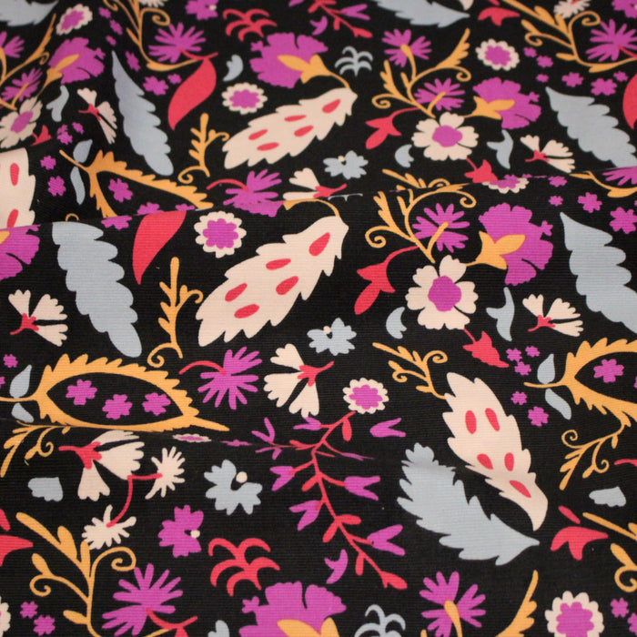 Tissu velours milleraies imprimé noir aux fleurs roses oranges - STANDARD 100 OEKO-TEX