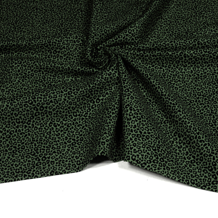 Tissu popeline de coton aux motifs léopard noir sur fond vert - COLLECTION LEOPARD - OEKO-TEX